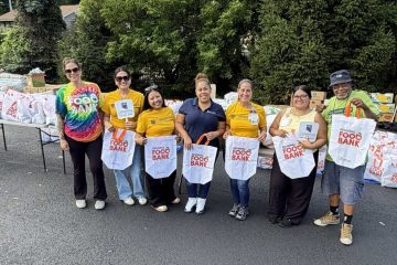 Volunteers distribute food to patients and community members during a food distribution event hosted by Cornerstone Family Healthcare and the Regional Food Bank in recognition of National Health Center Week at Cornerstone’s Kaplan Family Pavilion in Newburgh, N.Y.
